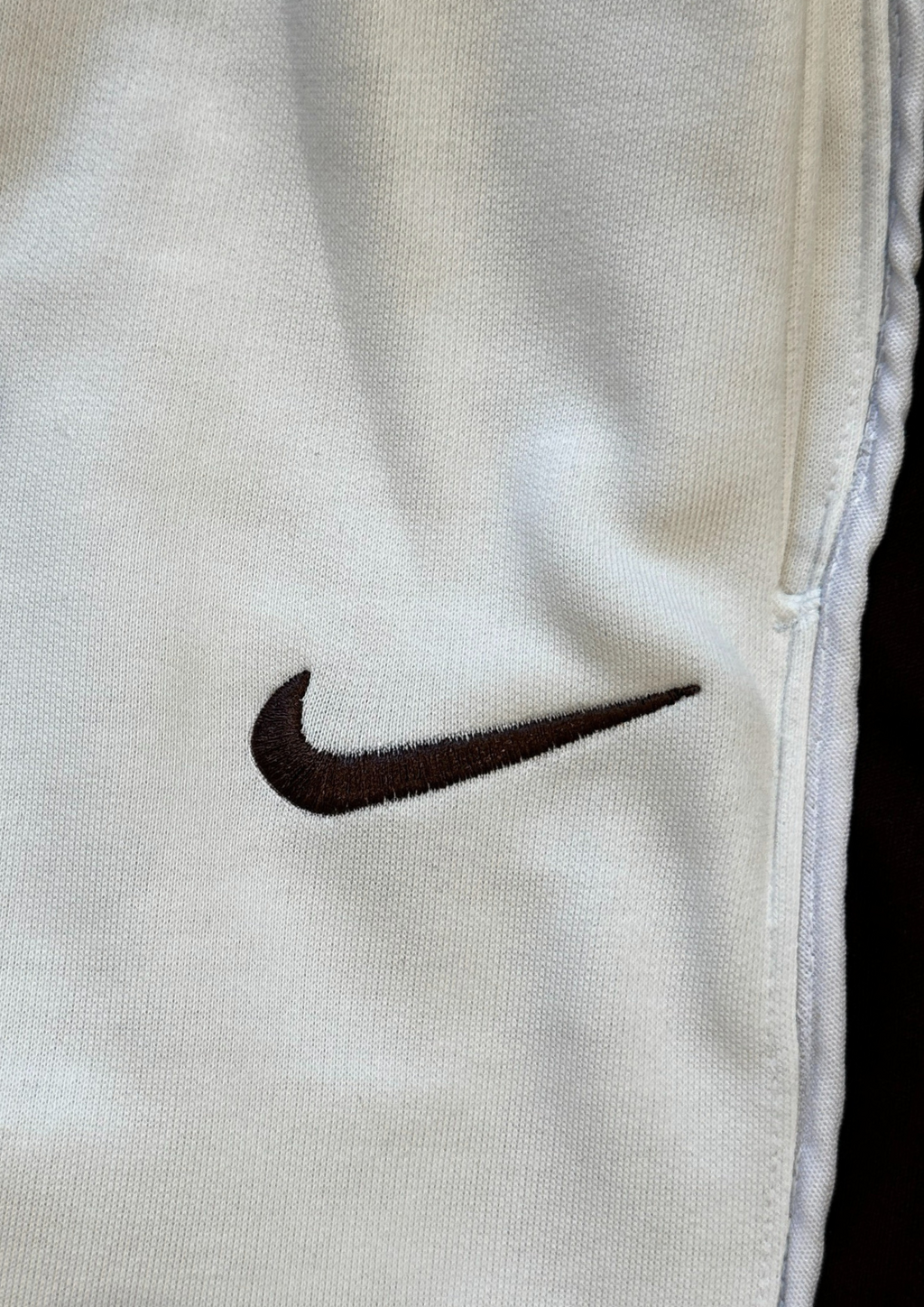 "Close-up of embroidered Nike logo – Nokkta Nike Wide-Leg Oversized Sweatpants"