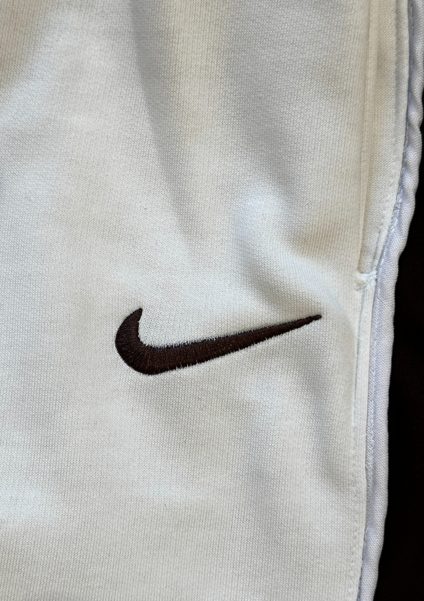 "Close-up of embroidered Nike logo – Nokkta Nike Wide-Leg Oversized Sweatpants"